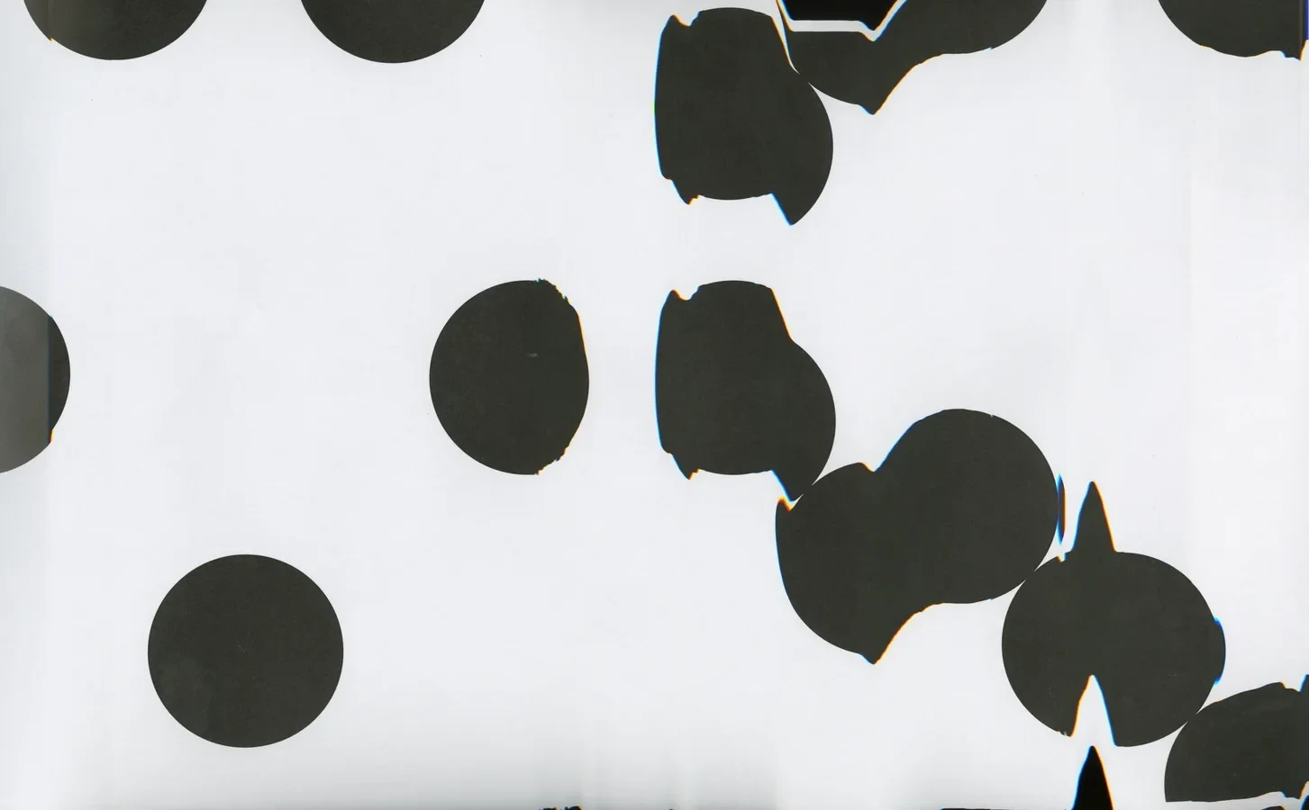 A zoomed-in print of the Firsts typeface, scanned and manipulated for glitch artifacts